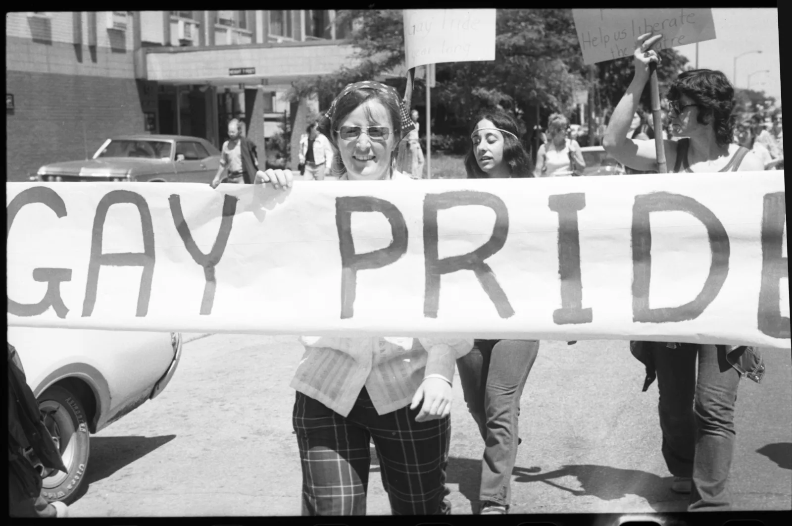 Midwest ms militante box 001 fl 001 003 A woman holding a sign that says "Gay Pride"