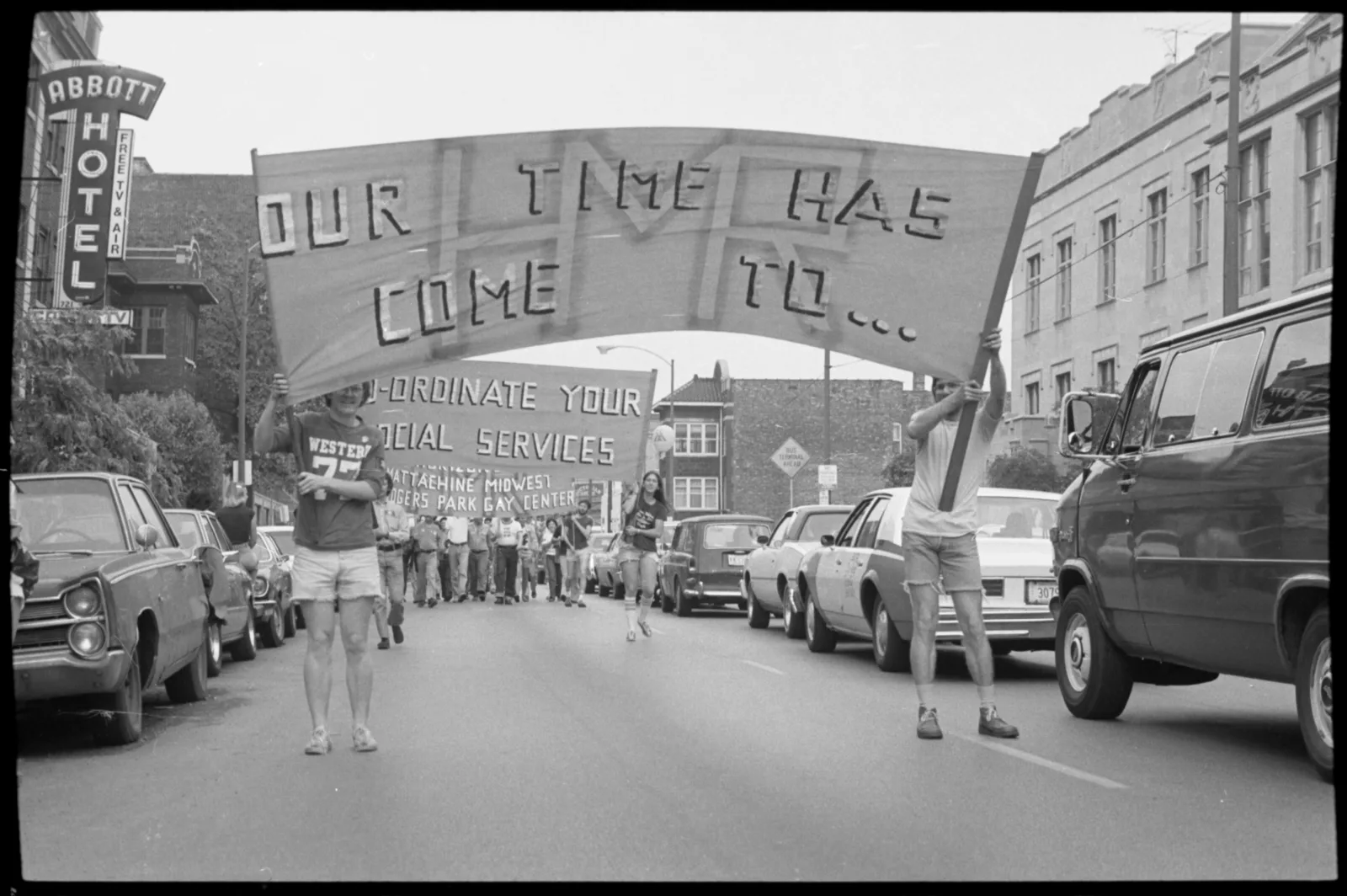Midwest ms militante box 001 fl 004 012 Two people holding up a sign in a parade. The sign reads, "Our time has come to..."